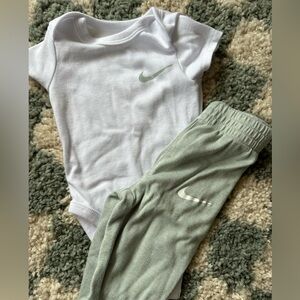 Pale, teal Nike baby matching set onesie